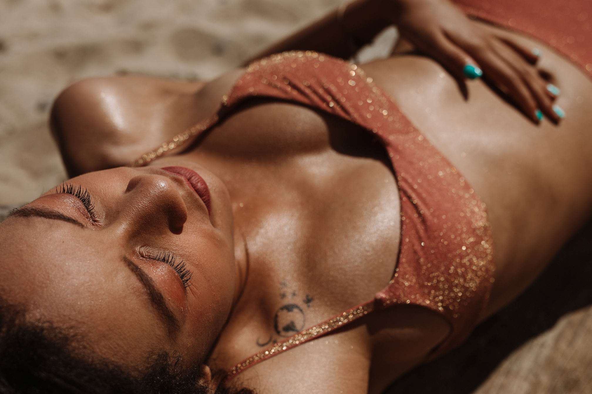 Woman in Bikini Lying on Beach